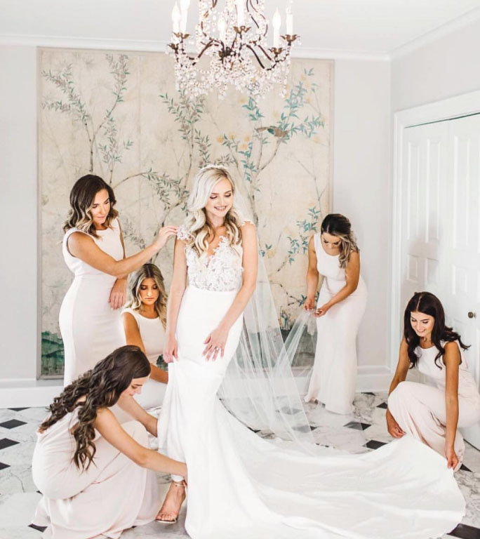 Сouple wearing a white gown and a black suit