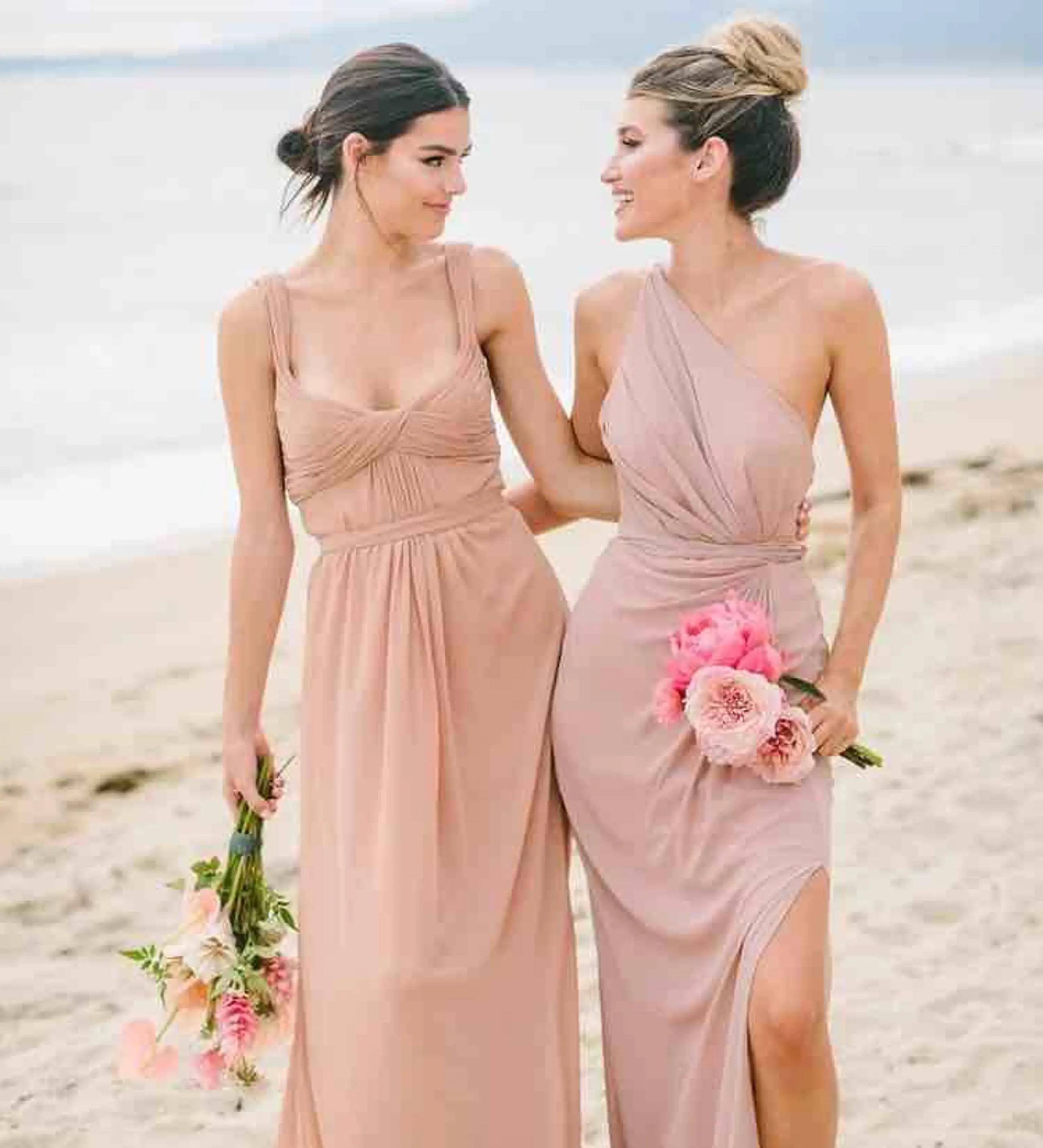 Models wearing a pink dresses. Mobile image